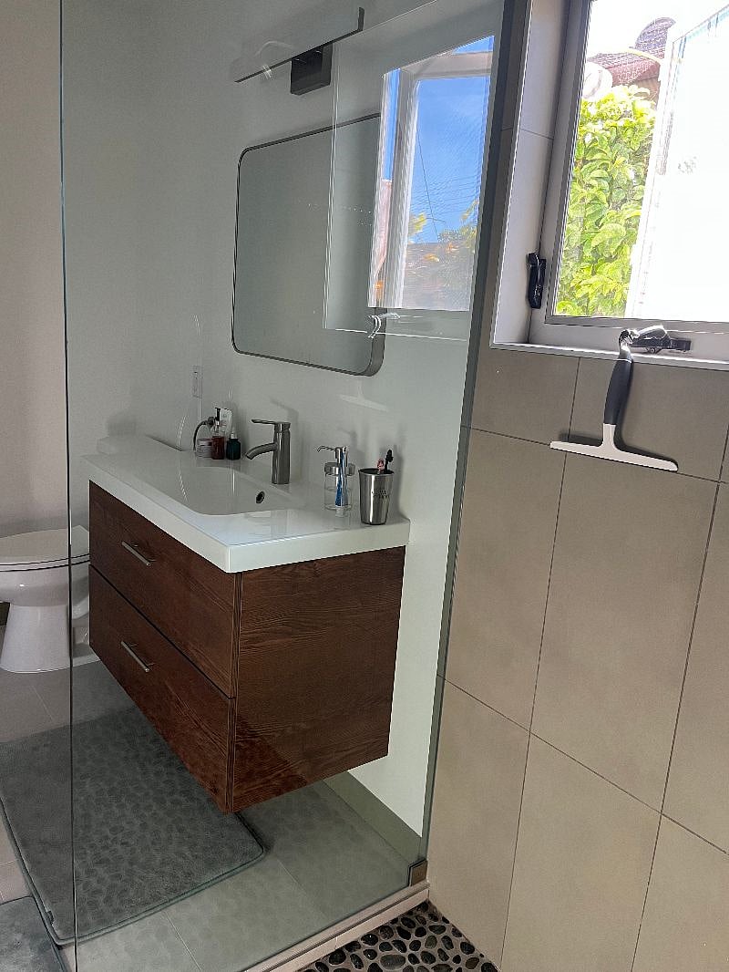Looking at the rest of the bathroom from the very large shower.