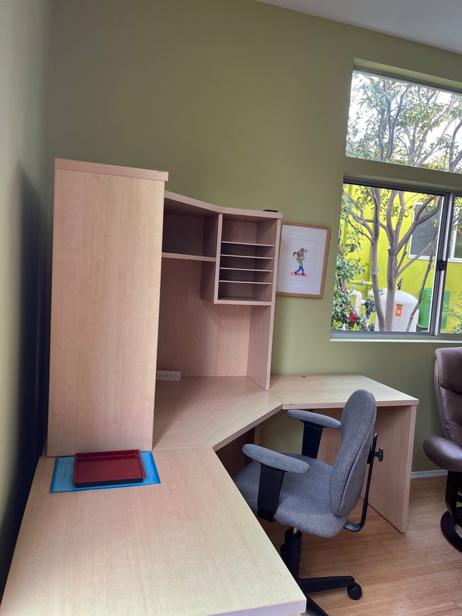 Roomy desk space with chair for those working from home.