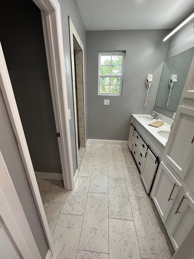 Large Bathroom with double sinks.