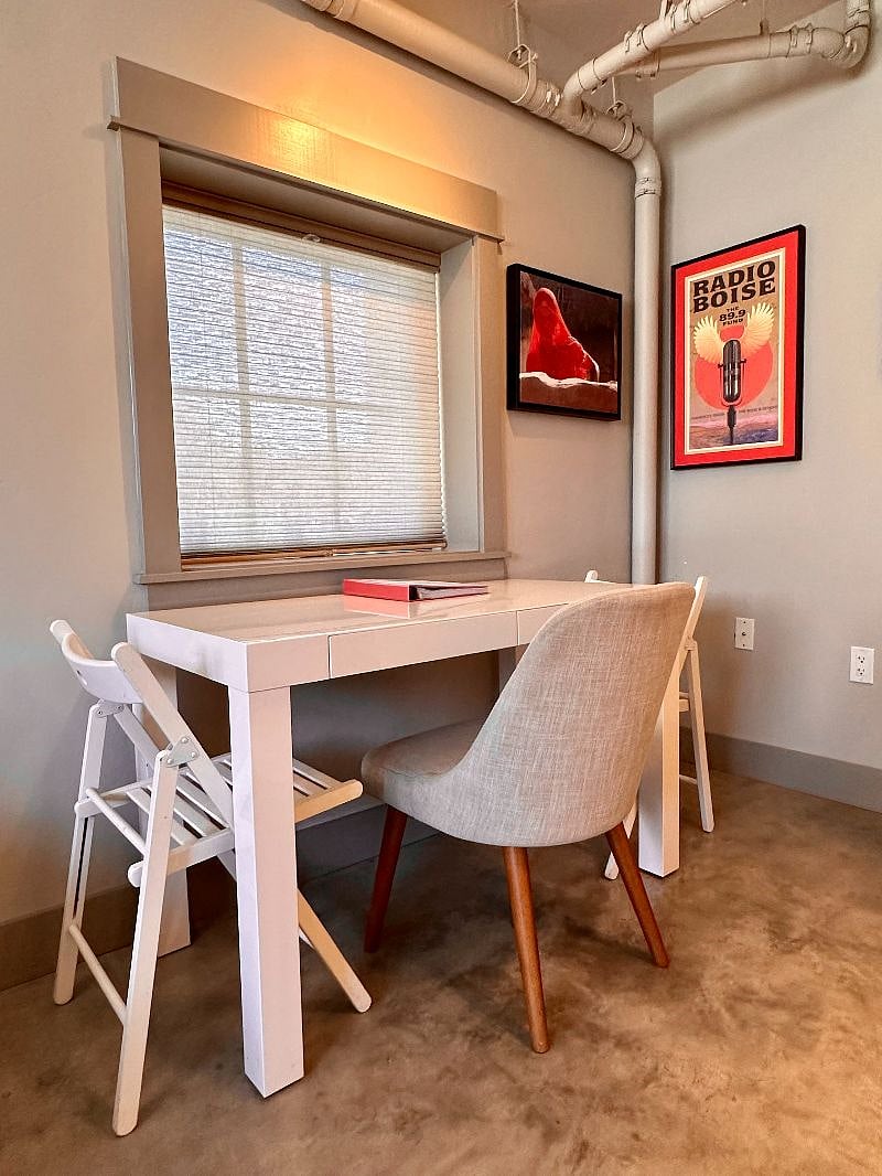 Dining table for three. Makes an excellent work desk by day!