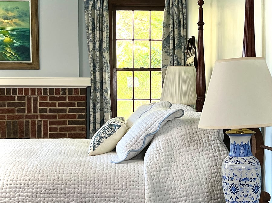 Serene primary bedroom with queen bed, blackout drapes and jack and jill bath