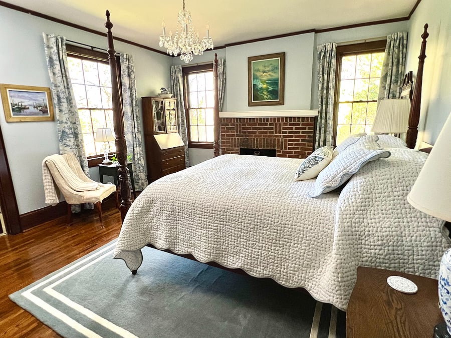 Serene primary bedroom with queen bed, blackout drapes and jack and jill bath