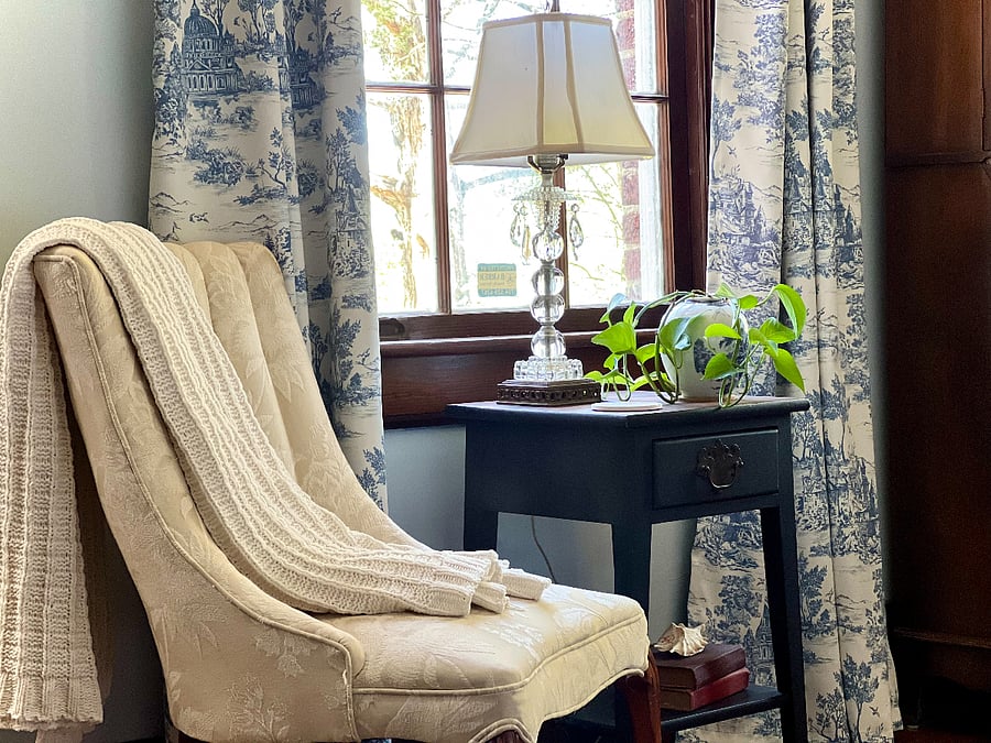 Serene primary bedroom with queen bed, blackout drapes and jack and jill bath