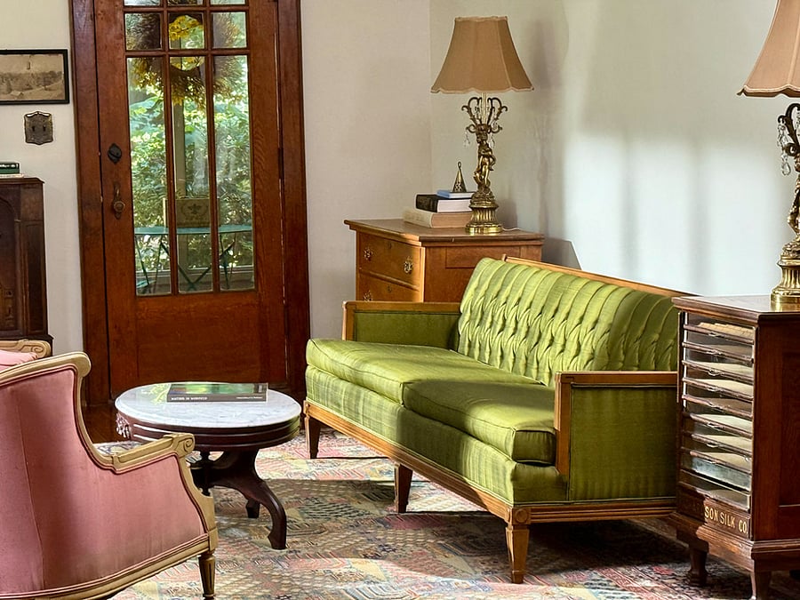 Living room connects to large front porch and screen porch