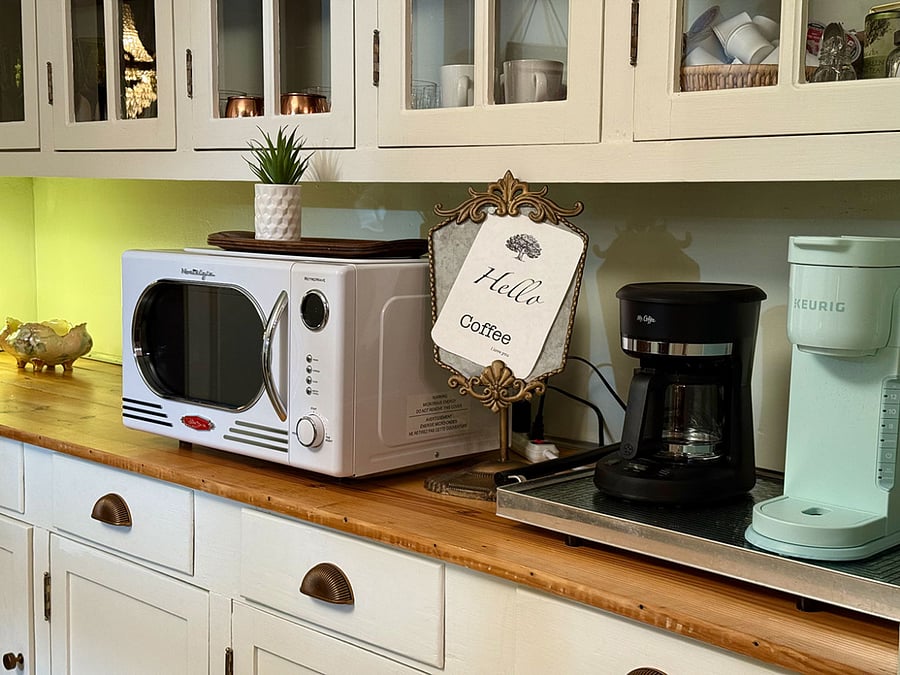 Butler's Pantry between kitchen and dining room. Coffee options : keurig, drip, mocha pot and french press. Coffee, tea, hot cocoa. Vintage barware.