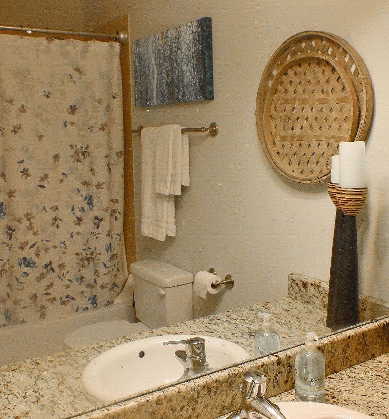 En-suite bathroom with bathtub and shower - towels provided.
