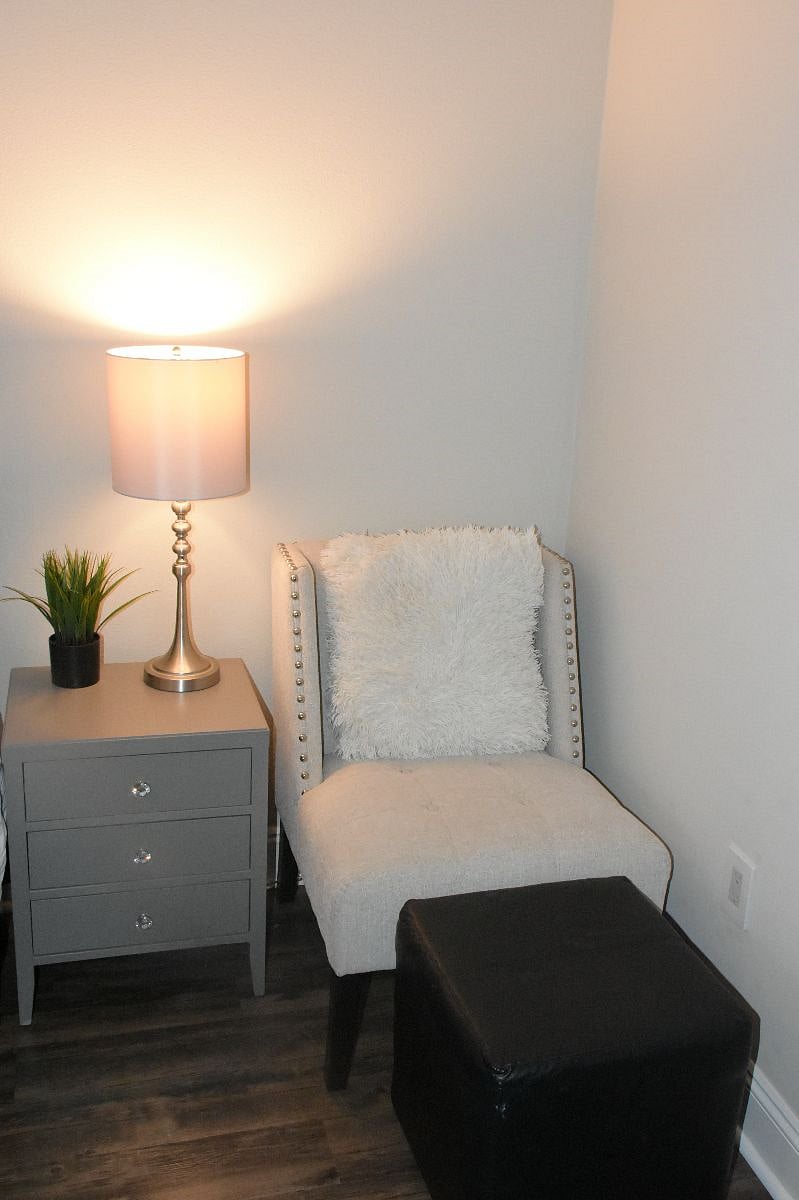 Side chair and ottoman for watching TV or reading.