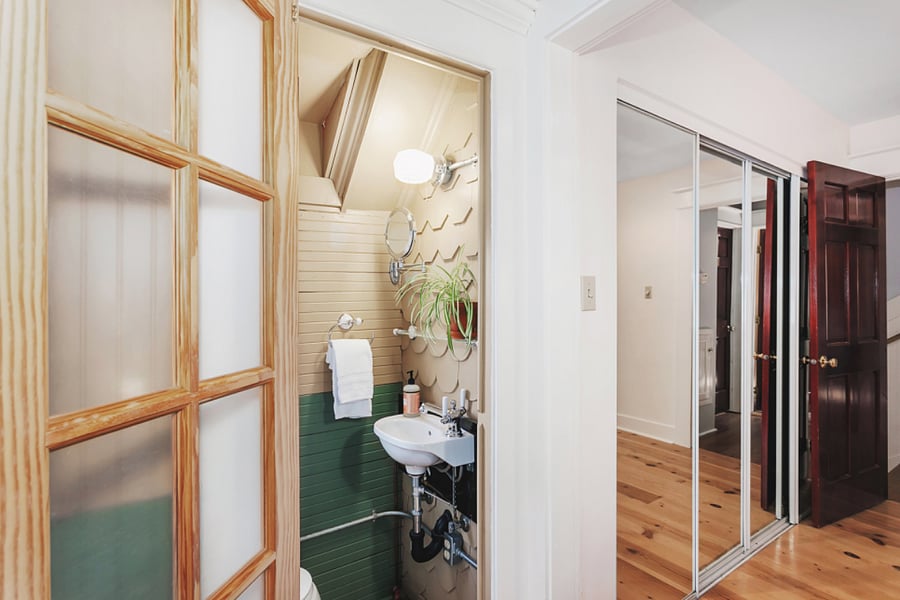 Private master suite, next to a closet with lots of mirrors