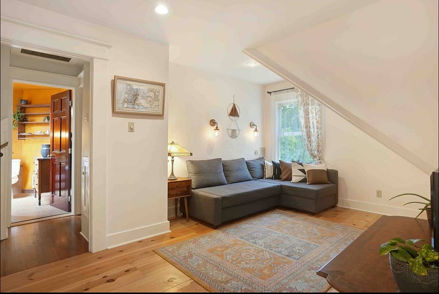 Private Master Suite features a large couch that converts to a queen size bed