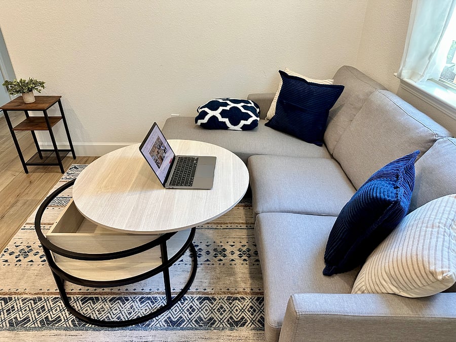 A comfy corner to work, eat, or unwind  the lift-top table makes this couch setup as functional as it is cozy 