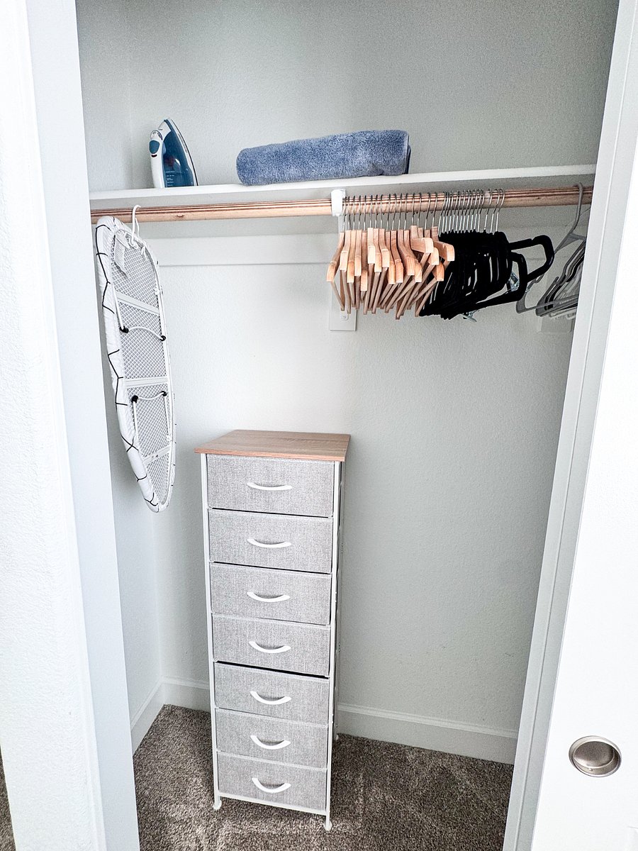 Unpack and settle in  closet includes dresser storage, hangers, iron, and ironing board for your convenience 