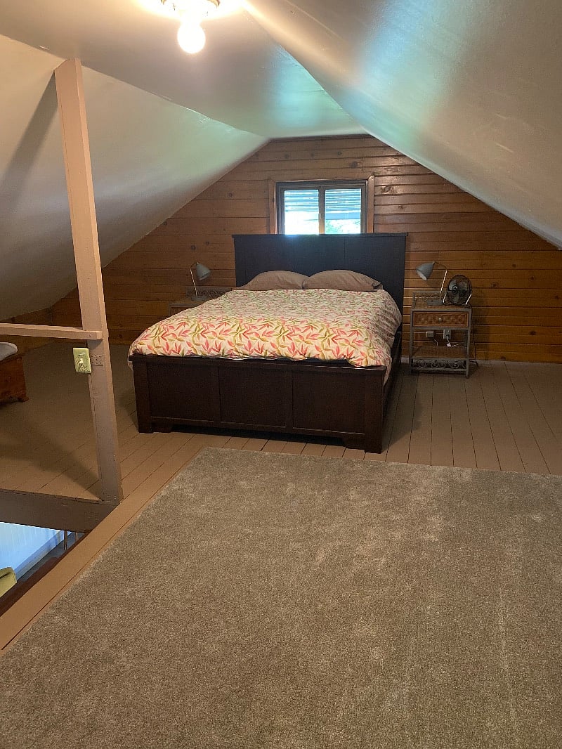 bed-side of the upstairs loft in cottage.