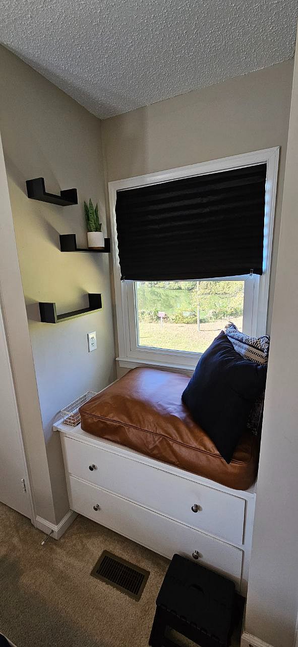 Primary Suite reading nook with view of the lake.