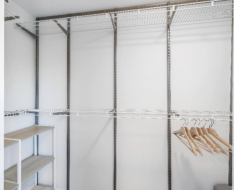 Large Walk In Closet with Shelves and Dresser