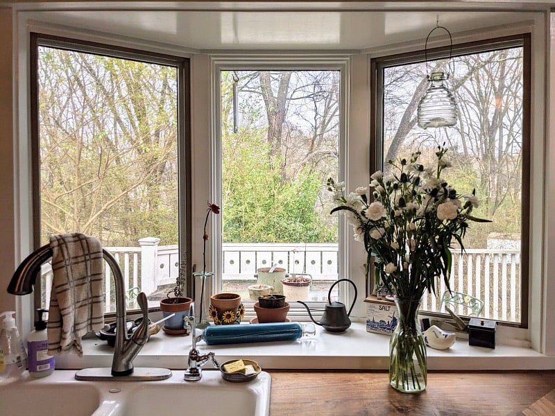 Butcher block countertop and beautiful view of wooded greenway from bay window in kitchen!