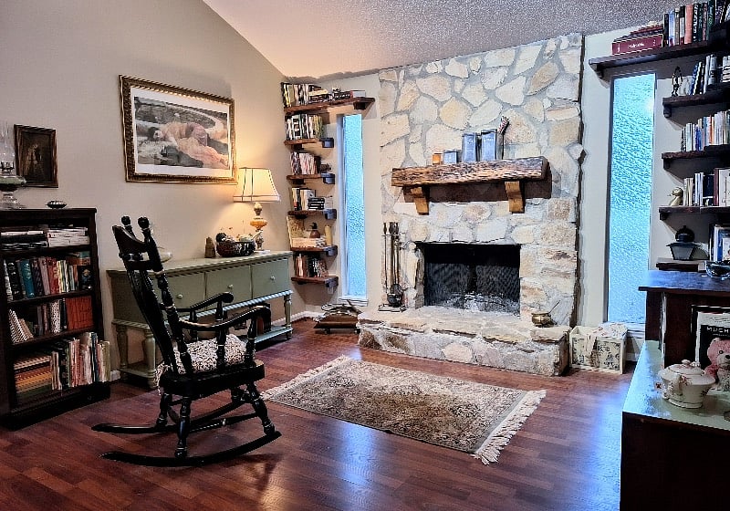 Stone fireplace w/ custom hand built mantel from reclaimed wood!