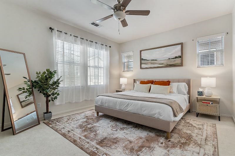 Master bedroom with king bed and attached full bath