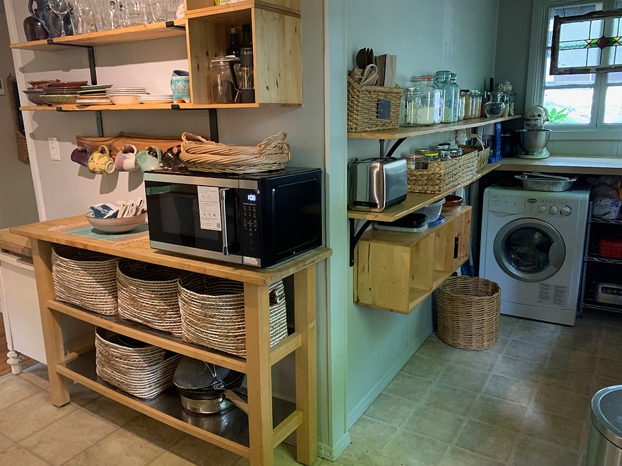Kitchen: microwave, handmade ceramics, stocked panty, washer/dryer combo