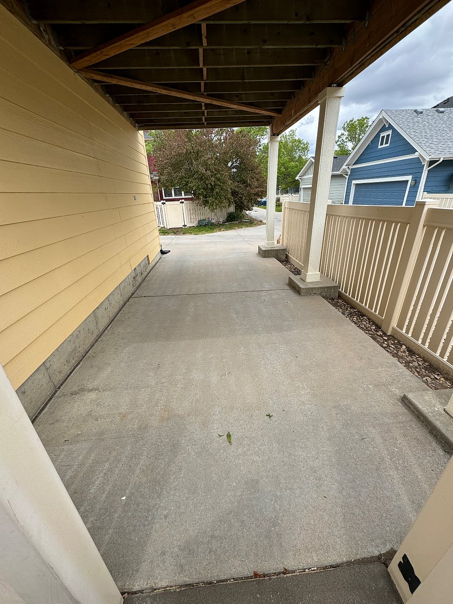 View from under the Carport, deck and parking space.