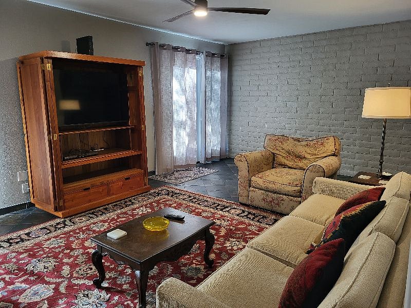 Living room, with doors opening to backyard patio