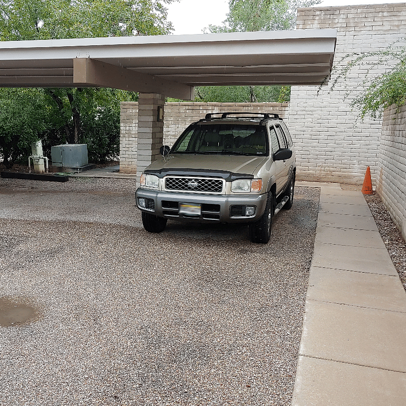 Two dedicated carport places, adjacent to the back walkway and steps away from the front courtyard.
