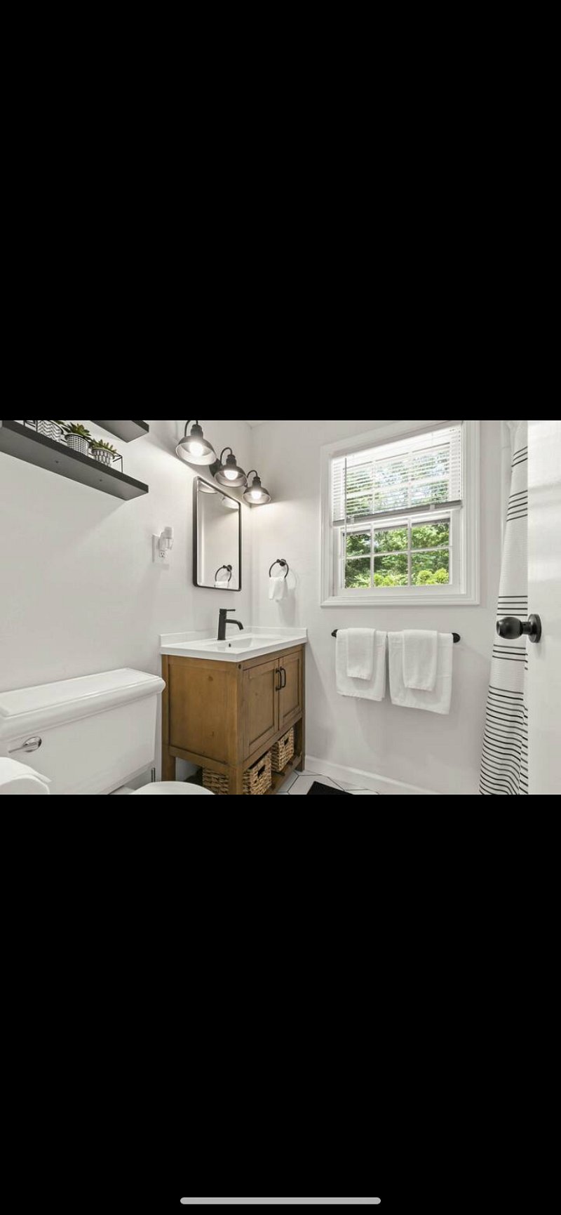 Newly renovated bathroom with medicine cabinet and new removable showerhead