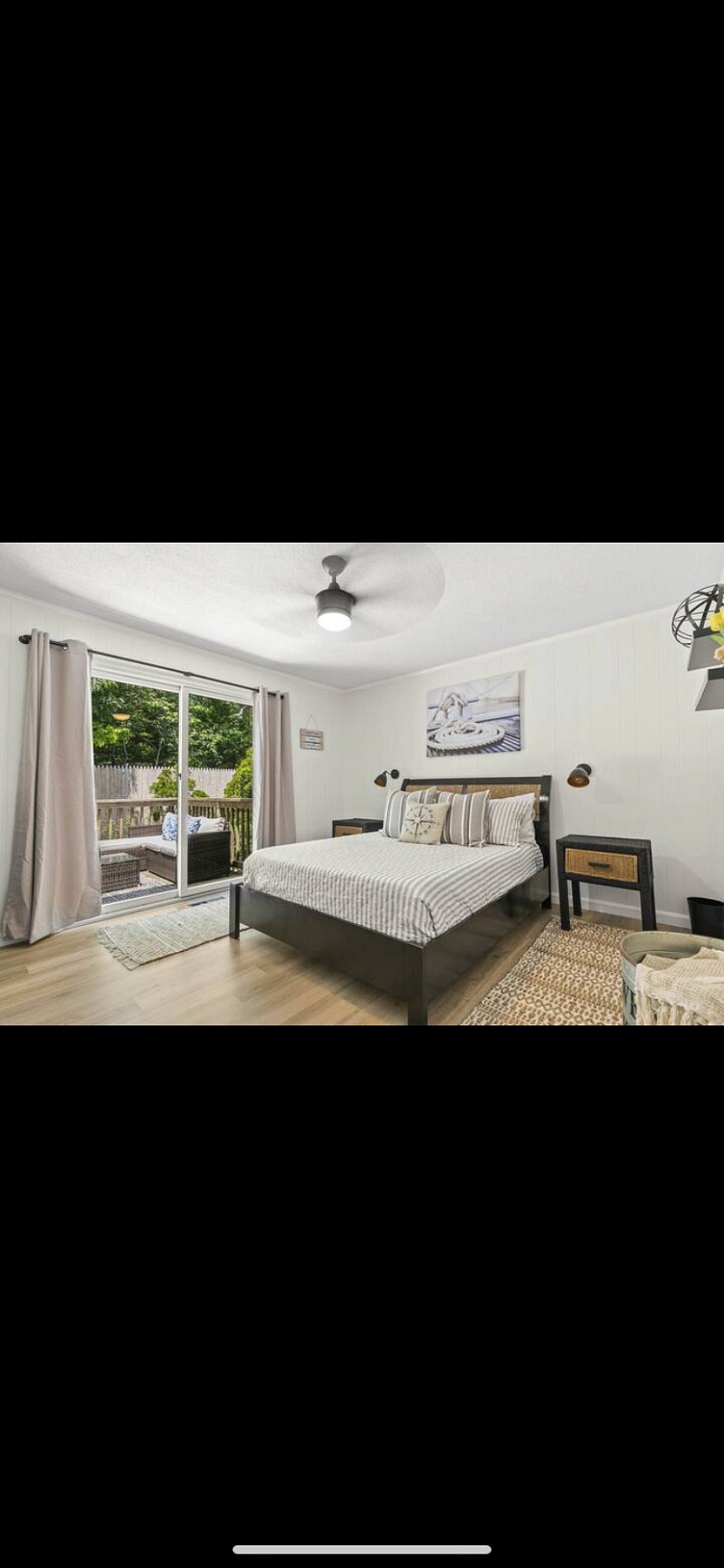 Large bedroom with large back deck and closet - 42 inch television