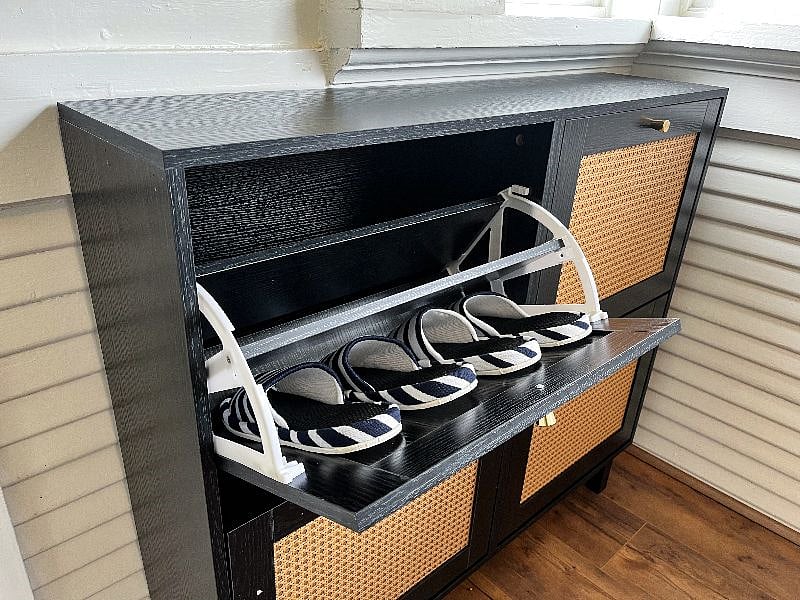 Shoe cabinet right next to front door.