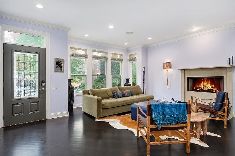 Living room, looking at the front windows and door.