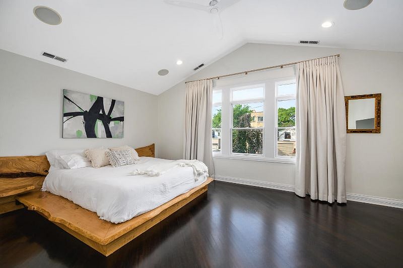 Primary bedroom with view of the backyard.