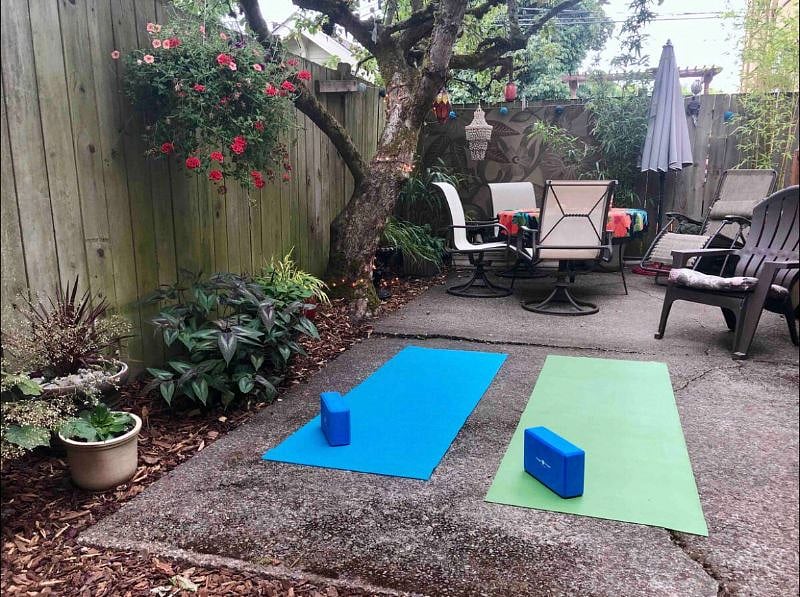 Back garden yoga and exercise space, room for outdoor dining, sitting around the propane fire and bike storage too!