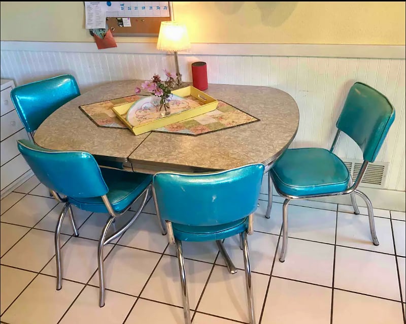 Shared kitchen table with a variety of tea and coffee making options. 