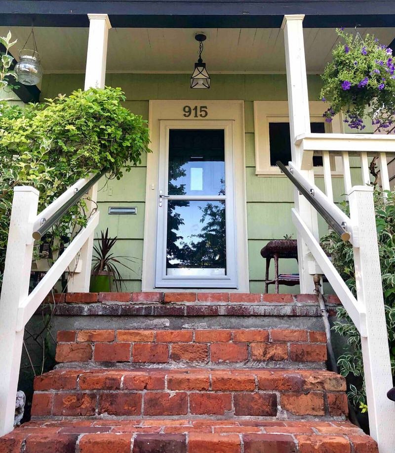 Well lit, keyless entry with Ring camera security and locking storm door.