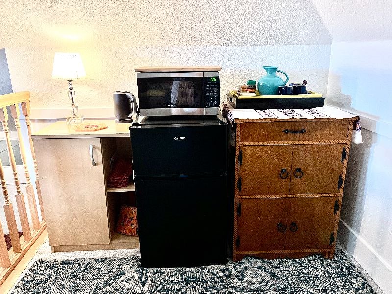kitchenette for convenience and comfort. mini fridge with high capacity freezer, microwave, tea kettle, toaster, toaster oven, coffee and tea service.