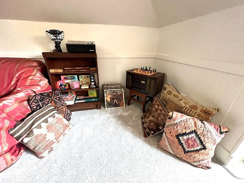 Victrola record player, an assortment of vintage records and a variety of games and puzzles.