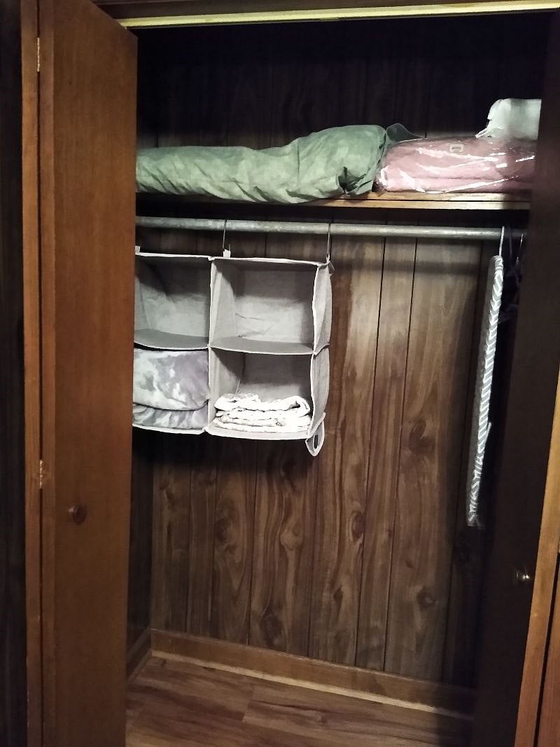 Full size closet. A dresser is located in small foyer entrance to bedroom.