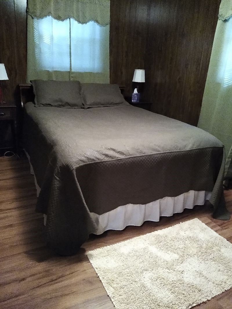 Bedroom with queen size bed.