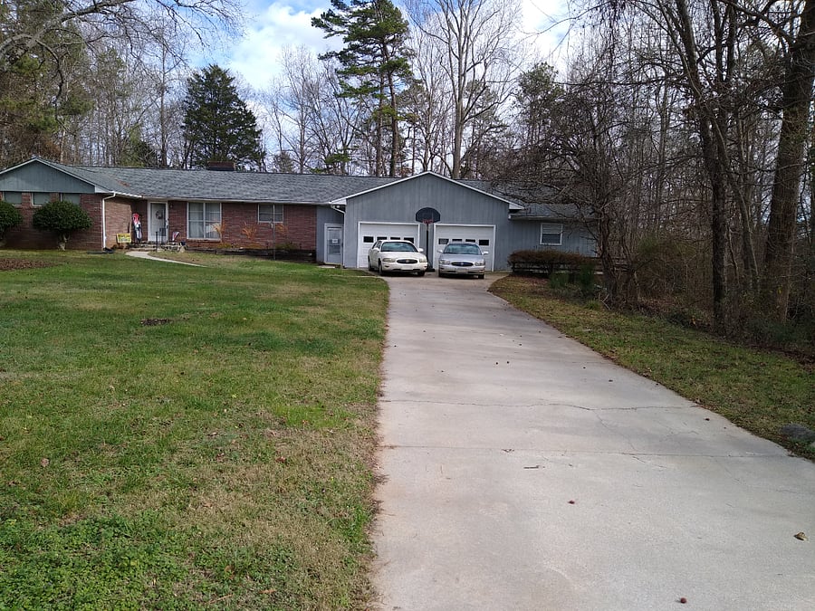 Apartment located to the right of garage.