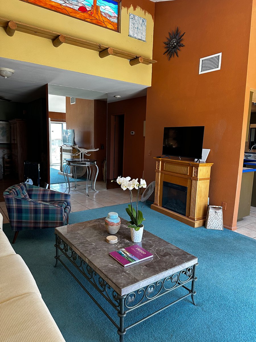 Living room, electric fireplace and smart TV.