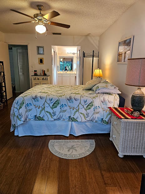 Master bedroom has 2 closets and large vanity area. Slider doors open to screened lanai.