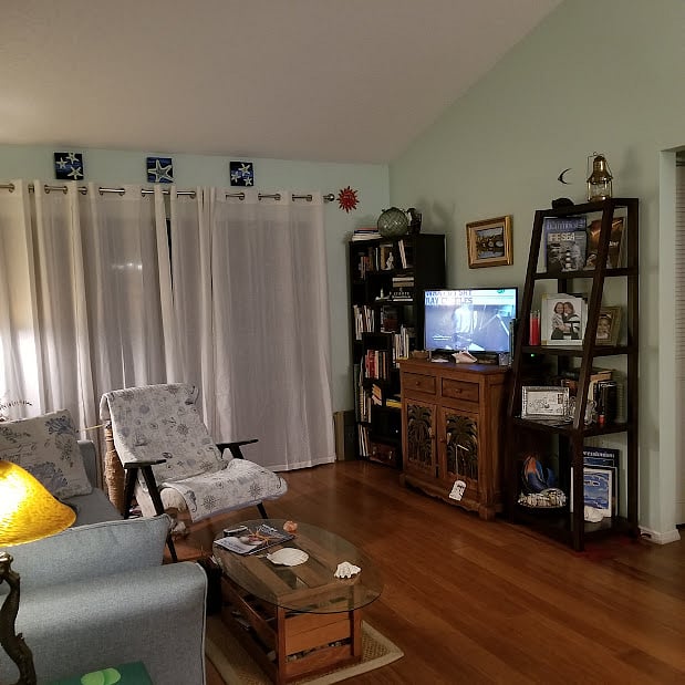 Living room sliders open to screened lanai