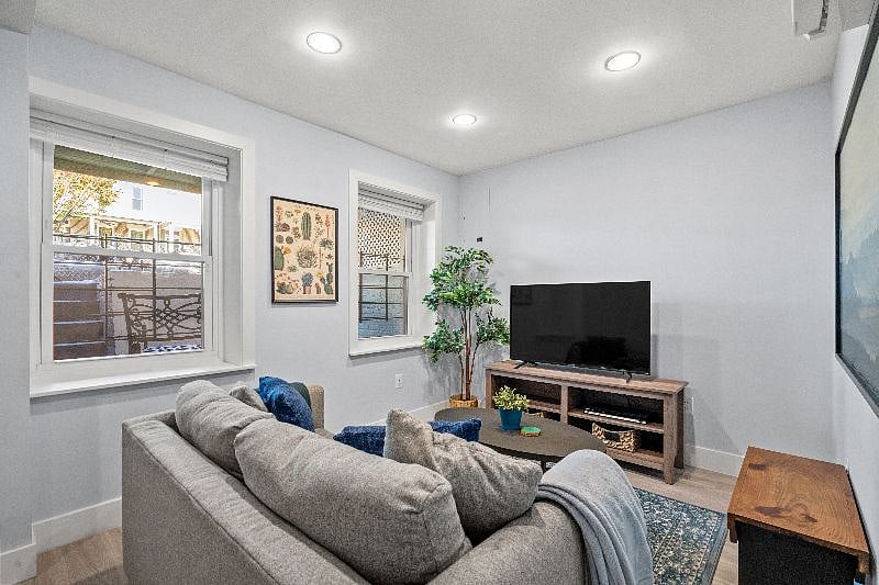 Living room with high ceilings and natural light