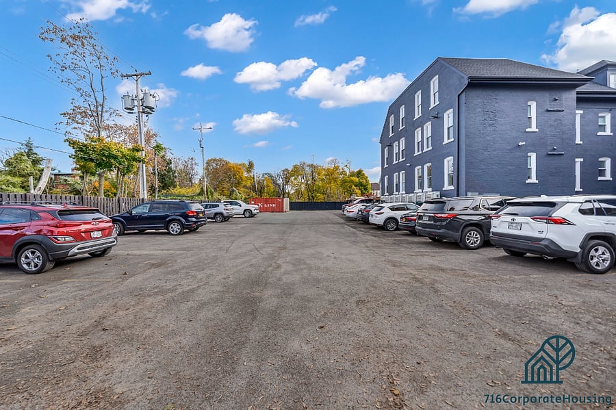 Two designated parking spots in the gated lot