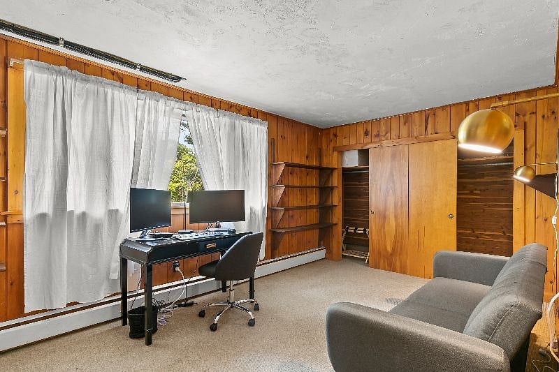 Downstairs office with dual monitors and docking station.