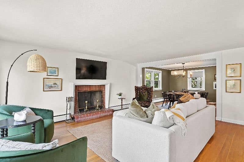 Living room with wood fireplace.