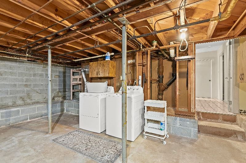 Downstairs basement with washer and dryer.