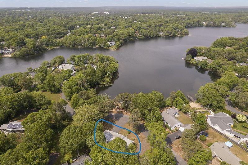 Long pond with house circled in blue.