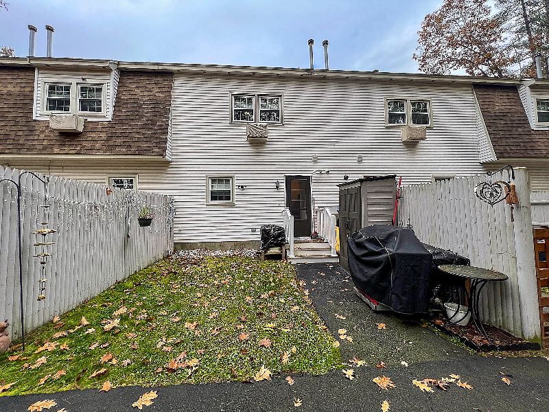 Private Backyard with BBQ Grill and Chairs