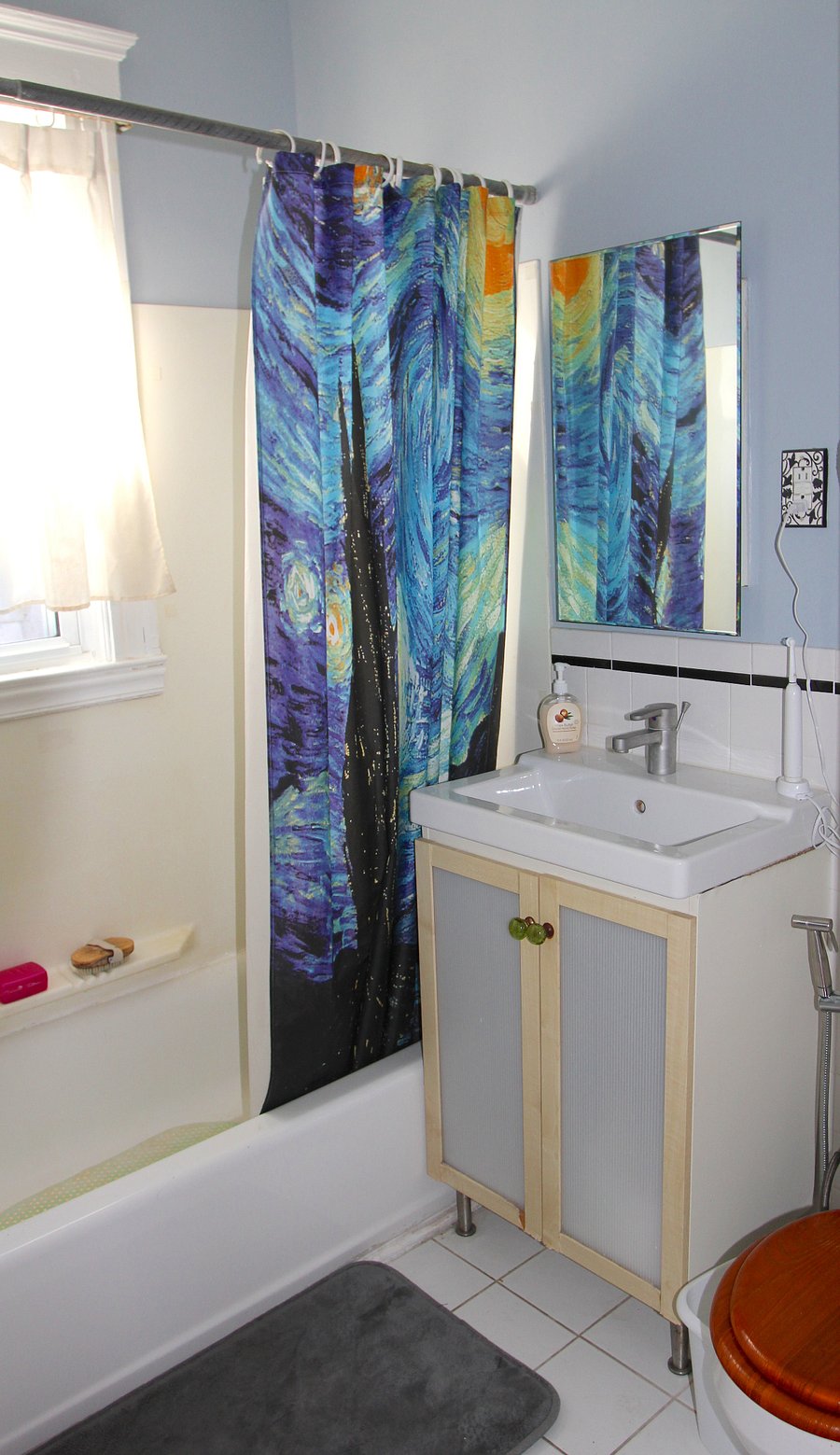 Bathroom with tub and plenty of storage space