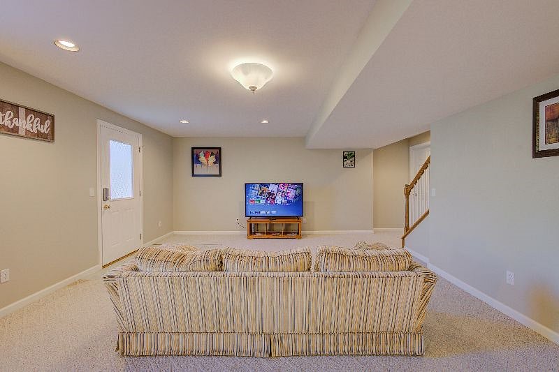 Sitting area with couch and smart TV.